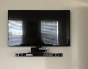 a flatscreen television mounted on a wall